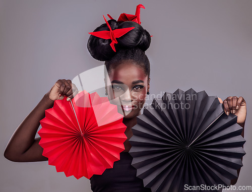 Image of Culture, makeup and creative with portrait of black woman in studio for origami, art and beauty. Traditional, cosmetics and paper design with model on grey background for asian, retro or color