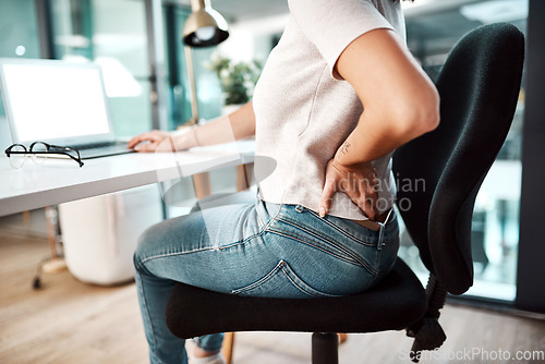 Image of Back pain, stress and business woman at desk with burnout, muscle ache and tension in sitting posture. Health, medical emergency and female worker with spine problem, accident and injury in office