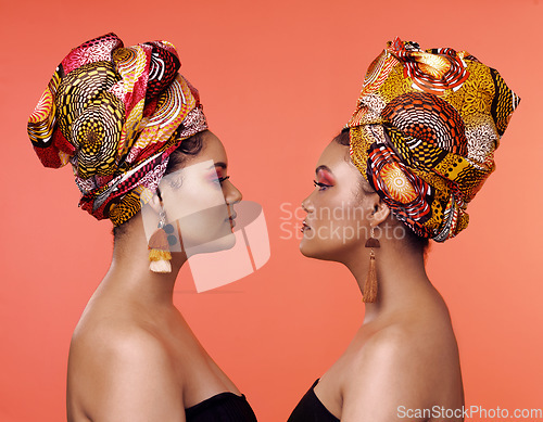 Image of African fashion, friends and profile of women on orange background with cosmetics, makeup and accessories. Glamour, beauty and face of female people with exotic jewelry, luxury style and head scarf