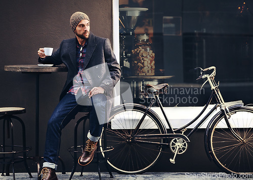 Image of Thinking, cafe and man with a coffee, bicycle and relax with thoughts, wonder and eco friendly transport. Male person, biker and guy with tea, outdoor and travel with winter fashion and a cappuccino