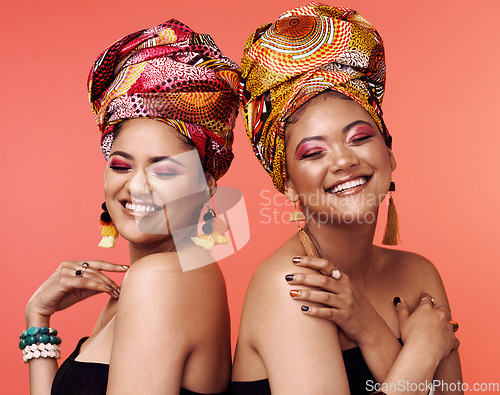 Image of Fashion, friends and African women with beauty on orange background with cosmetics, makeup and accessories. Glamour, luxury and face of female people with exotic jewelry, traditional style and scarf