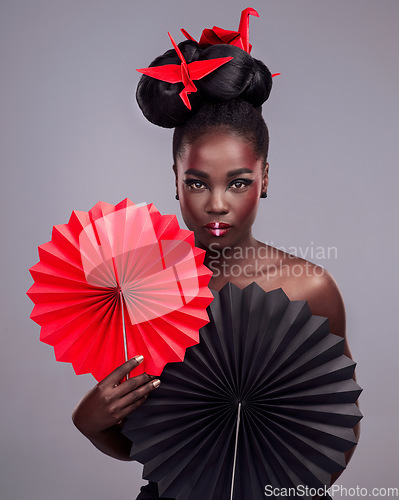 Image of Beauty, makeup and origami with portrait of black woman in studio for creative, art and culture. Traditional, cosmetics and paper design with model on grey background for asian, retro or color