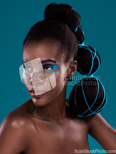 Image of Idea, beauty and cosmetics with a model african woman in studio on a blue background for hair or fashion. Face, makeup and idea with an attractive young female person posing for trendy haircare