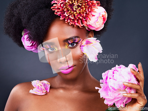 Image of Makeup, flowers and hair with portrait of black woman for beauty, creative or spring. Natural, cosmetics and floral with face of model isolated on studio background for art, self love or confidence