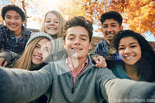 Image of Teenager, group of friends and selfie in park, nature or fall trees and teens smile, picture of friendship and happiness for social media. Portrait, face and diverse people together for autumn photo