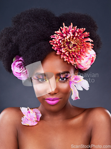 Image of Art, flowers and portrait of black woman in studio for beauty, creative and spring. Natural, cosmetics and floral with african model isolated on dark background for makeup, self love or confidence