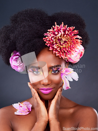 Image of Makeup, flowers and art with portrait of black woman in studio for beauty, creative or spring. Natural, cosmetics and floral with model isolated on gray background for color, self love or confidence