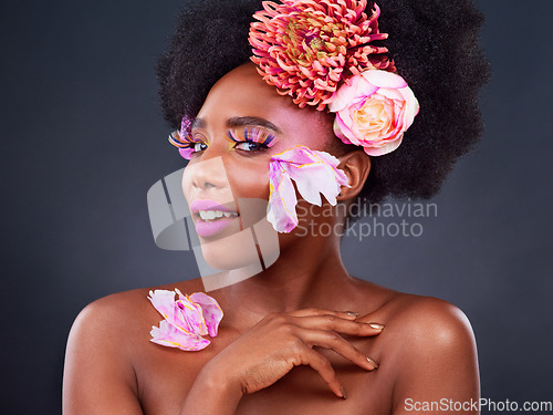 Image of Makeup, flowers and beauty with portrait of black woman for beauty, creative and spring. Natural, cosmetics and floral with model isolated on studio background for art, self love or confidence