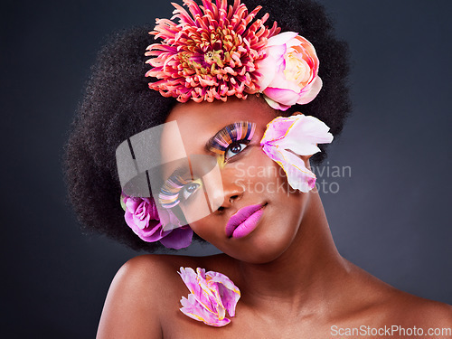 Image of Makeup, flowers and face of black woman in studio for beauty, creative and spring. Natural, cosmetics and floral with african model isolated on background for art, self love or confidence