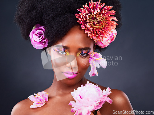 Image of Beauty, flowers and portrait of black woman in studio for makeup, creative and spring. Natural, cosmetics and floral with face of model isolated on background for art, self love or confidence