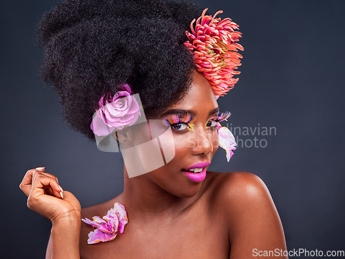 Image of Makeup, flowers and black woman portrait in studio for organic beauty on black background. Floral, face and African female model pose with eco friendly, natural and cosmetics with isolated mockup