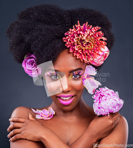 Image of Makeup, portrait and black woman with flowers in studio for natural cosmetics on dark background. Floral, face and African female model pose with eco friendly, beauty and care on isolated color
