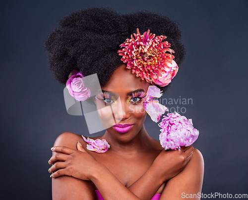 Image of Flowers, portrait and black woman with makeup in studio for organic beauty on dark background. Floral, face and African lady model smile for eco friendly, natural and cosmetics with isolated mockup