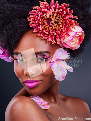 Image of Makeup, flowers and art with portrait of black woman for beauty, creative and spring. Natural, cosmetics and floral with face of model isolated on studio background for color, self love or confidence