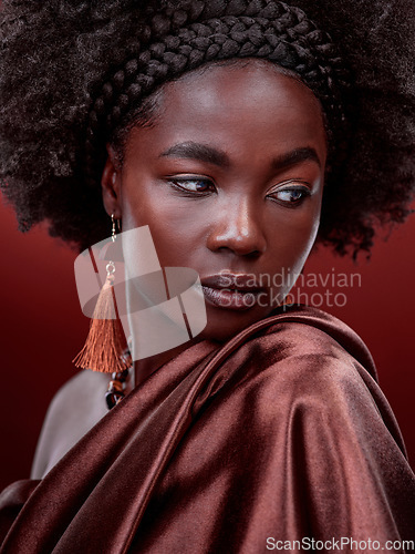 Image of Natural beauty, idea and black woman with fashion in studio isolated on a red background. Aesthetic, makeup cosmetics and African female model with stylish outfit, traditional jewelry and culture.