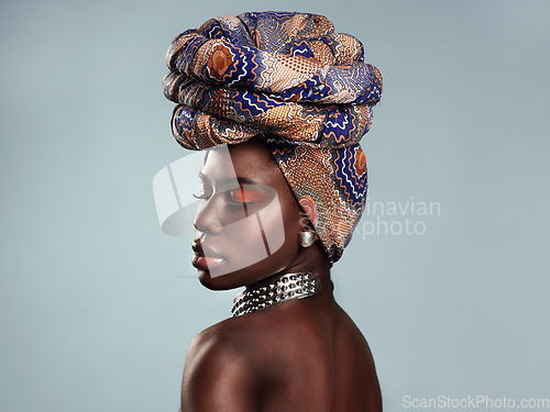 Image of Black woman, profile and African turban, fashion and beauty with makeup isolated on studio background. Natural cosmetics, eyeshadow and female model with traditional head wrap, mockup space and style