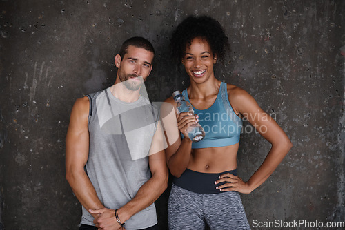 Image of Fitness, happy and portrait of couple with water after workout, body builder training and exercise outdoors. Sports, relationship and man and woman after running for endurance, wellness and energy