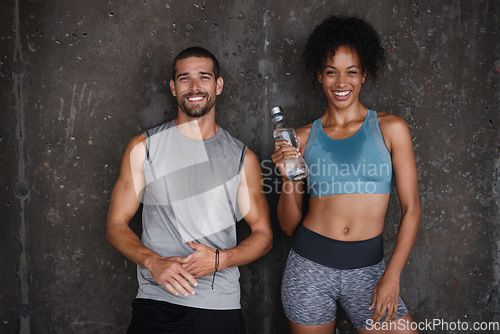 Image of Fitness, happy and couple rest in city after workout, body builder training and exercise outdoors. Sports, relationship and man and woman laughing after running for endurance, wellness and health