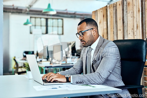 Image of Business, startup and man with a laptop, typing and planning with connection, modern office or focus. Male person, employee or entrepreneur with a pc, technology or professional with career or growth