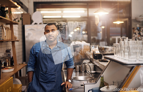 Image of Coffee shop, barista and portrait of man in restaurant for service, working and standing in cafe bar. Small business owner, bistro startup and male entrepreneur by cafeteria counter ready to serve