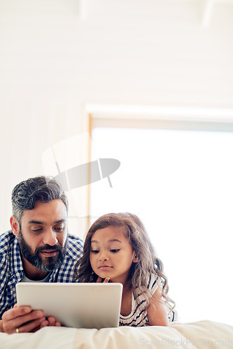 Image of Love, digital tablet and father with daughter on a bed for reading, story and learning in their home together. Family, streaming and parent and girl relax in bedroom online with ebook or subscription