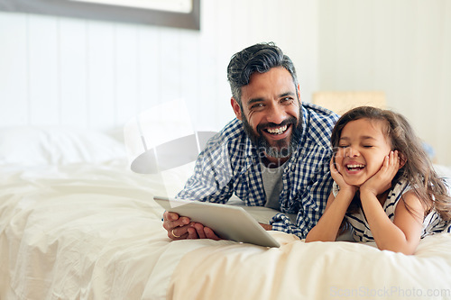 Image of Bed, digital tablet and girl laughing with father, relax and sharing comic or joke in their home together. Happy, comedy and parent and with girl in bedroom online for funny meme or subscription