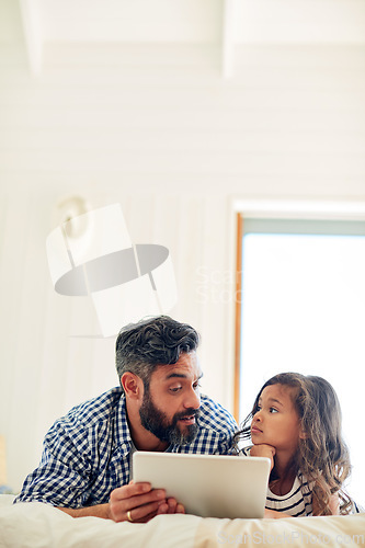 Image of Bed, digital tablet and daughter with father relax with reading, story and learning in their home together. Love, conversation and parent and girl relax in bedroom online for subscription service