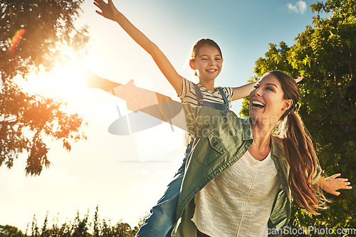 Image of Piggyback, flying and a mother and child in nature for bonding, happiness and love in summer. Laughing, smile and a mom and a girl kid in a park or garden for playing together and quality time