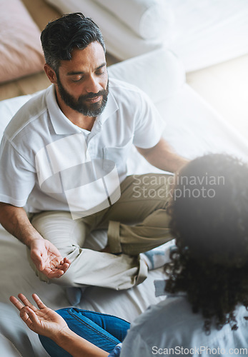 Image of Couple, relax and meditation in living room for spiritual wellness, fitness or zen workout together at home. Man and woman relaxing in relationship, meditate or yoga class on floor for peaceful mind