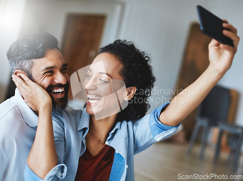 Image of Happy couple, smile and love for selfie, profile picture or social media vlog together relaxing at home. Man and woman in relationship smiling for photo, online post or bonding memory in living room