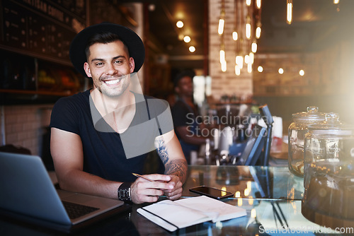 Image of Portrait, smile and man in a cafe, barista and startup success with a laptop, planning and manager. Face, male employee and entrepreneur with a notebook, coffee shop and business owner with happiness