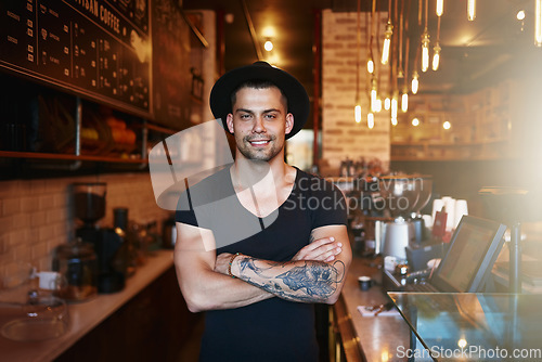 Image of Portrait, smile and man with arms crossed, cafe and barista with startup success, restaurant and happiness. Face, happy male person and entrepreneur in a coffee shop, employee and business owner