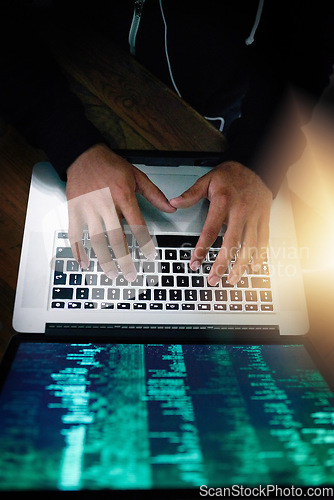 Image of Hands, laptop and overhead with a man programmer coding while typing on a keyboard for software development. Computer language, information technology and cyberspace with a male coder in the office