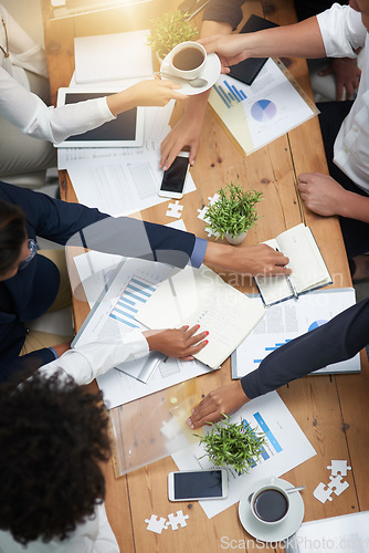 Image of Business people in meeting with collaboration, market research paperwork one table and analysis of graphs with team. Review information, data analytics and employees working together with top view