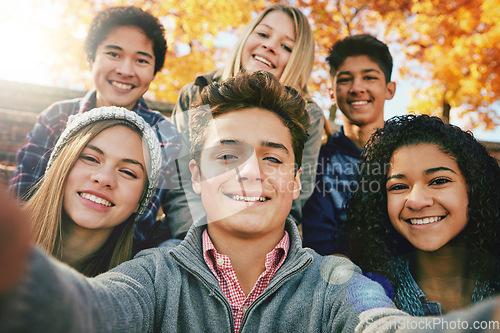 Image of Selfie, teenager and group of friends in park, nature or fall trees and teens smile, picture of friendship and happiness for social media. Portrait, face and happy people together for autumn photo