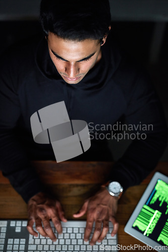 Image of Hacking, man and computer keyboard for programming, coding software or password hacker, tablet and dark room. Online code, night cyber security or programmer person hacking data on digital tech above