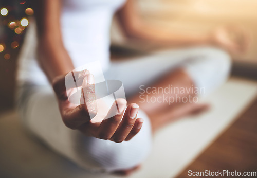 Image of Woman, hands and yoga in meditation for relax, zen workout or spiritual wellness on floor mat at home. Closeup of female yogi hand for calm relaxation, awareness or mental wellbeing indoors