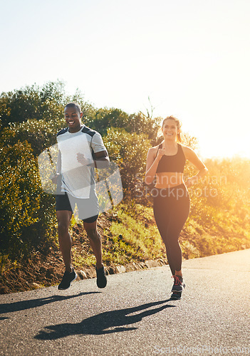 Image of Freedom, running and happy with couple in road for workout, cardio performance and summer. Marathon, exercise and teamwork with black man and woman runner in nature for sports, training and race