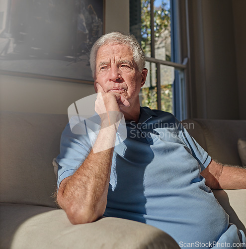 Image of Lonely senior man thinking in home, couch and lounge about future anxiety, remember memory and alzheimer. Retirement, elderly male and nostalgia memories on sofa, depression and dementia in isolation