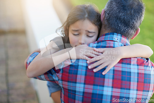 Image of Hug, father and girl with love, sympathy and comfort with grief, loss and depression with pain. Family, female child or male parent with kid, daughter or dad embrace, sad or care with anxiety or fear