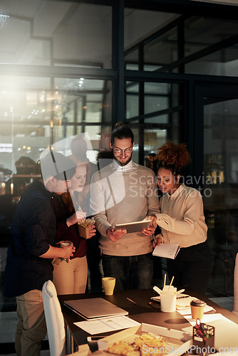 Image of Night business, young people and tablet technology of planning, research or collaboration in dark office. Diversity, digital ideas and working late online in designer agency, teamwork or productivity