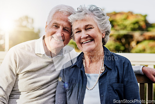 Image of Senior couple, portrait and relaxing together outdoors or romantic retirement and park bench. Elderly, partners and affectionate faces or in love or date and feeling care or happy outside garden