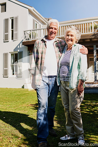 Image of Senior couple, new home and hug on grass or outdoors celebrating property or mortgage together. Elderly, partners and outside house or moving in real estate or security for retired homeowners