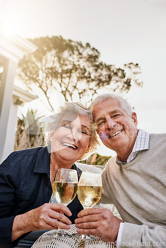 Image of Love, cheers and wine, portrait old couple celebrate romantic anniversary date on patio of vacation home. Champagne, senior man and happy woman with toast, happiness and romance on holiday with smile