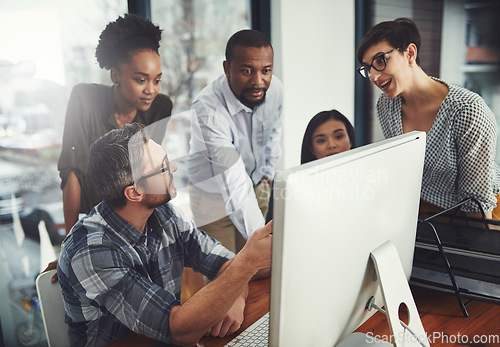 Image of Teamwork, computer and coaching with business people in meeting for project management, review or planning. Technology, website and training with employees in office for collaboration and idea