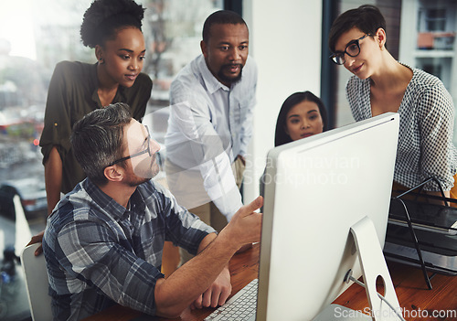 Image of Teamwork, computer and pointing with business people in meeting for project management, review or planning. Technology, website and training with employees in office for collaboration and idea