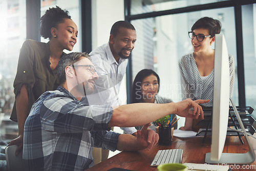 Image of Teamwork, computer and strategy with business people in meeting for project management, review or planning. Technology, website and training with employees in office for collaboration and idea