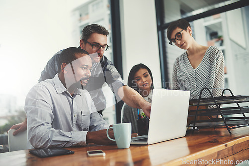 Image of Teamwork, laptop and pointing with business people in meeting for project management, review or planning. Technology, website and training with group of employees in office for collaboration and idea