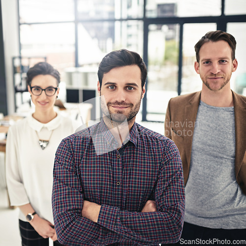 Image of Portrait, teamwork and leadership with a business man and his team standing in the office together. Management, leader and collaboration with a group of businesspeople looking confident about work