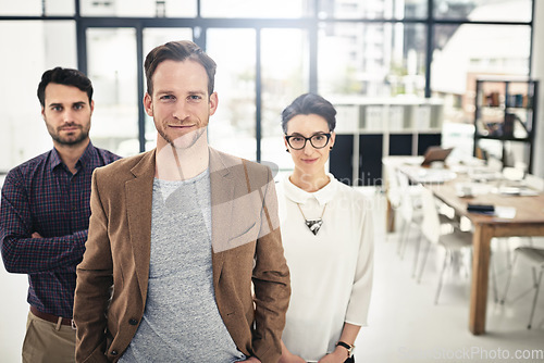 Image of Portrait, teamwork and management with a business man and his team standing in the office together. Leadership, manager and collaboration with a group of businesspeople looking confident about work